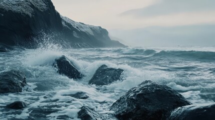Fototapeta premium Dramatic ocean waves crashing on rocky shore.
