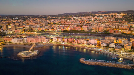 Small Italian town seen from above, sea and cars. Civitavecchia