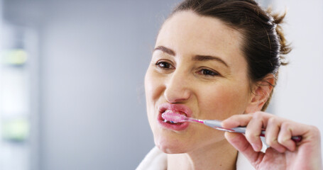 Hygiene, bathroom and woman brushing teeth for dental health, wellness and morning routine. Oral...