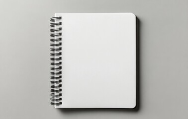 Blank spiral notebook on a light surface ready for sketches and notes