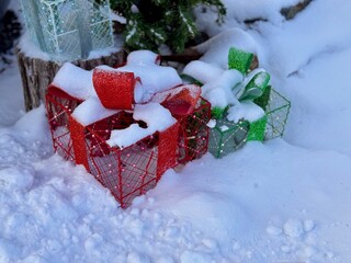 winter Christmas holiday decorations on snow near house