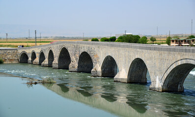 Fototapeta premium The Historical Murat Bridge, located in Mus, Turkey, was built during the Seljuk period in the 13th century.
