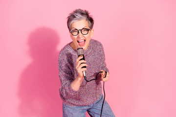 Photo of adorable funky woman wear jumper singing karaoke empty space isolated pink color background