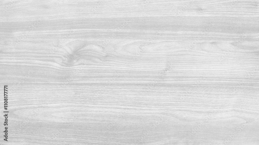 Poster a wooden surface with a grainy texture. the wood is grey and has a natural look. the surface is smoo