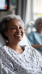 A smiling woman in a hospital bed is comforted