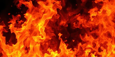 Fototapeta premium Abstract pattern of bright red, orange, and yellow fire flames against a stark black background, intensity, black background