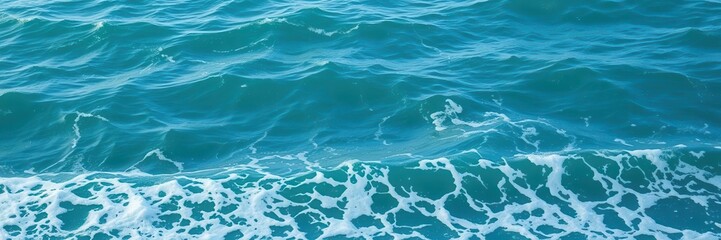 Fototapeta premium Crystal clear turquoise water with gentle foam and rolling waves, foam, ocean
