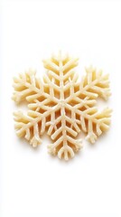 Obraz premium close up of one dry pasta in shape of a snowflake isolated on white background