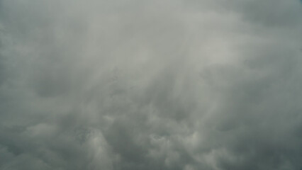 A terrible black cloud hangs in the sky before the rain. Bad weather. Hurricane and thunder over the city. Climate change and natural disasters. Bad mood and despondency.