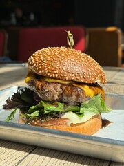 Juicy gourmet burger with sesame bun and fresh ingredients