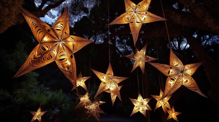 Many large star-shaped lights hang from trees. Decorative lights golden, intricate. Look like beautiful, hand-made paper stars. Create magical night ambiance. Maori New Year celebration. Night scene.
