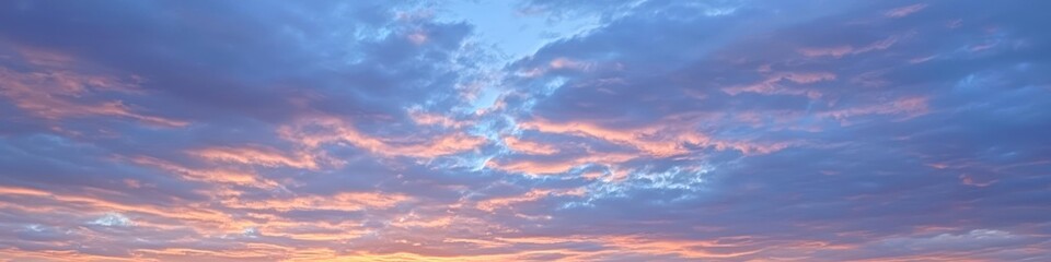 Obraz premium Soft hues a colorful sunset sky with gentle clouds
