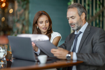 Professional Business Meeting Between Colleagues in Modern Office Setting