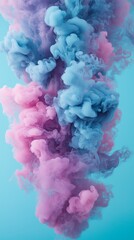 Fototapeta premium Vibrant pink and blue smoke clouds swirl together, creating an ethereal and dreamy atmosphere.
