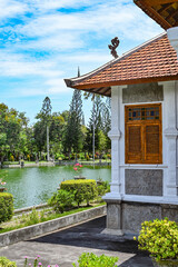 Palace in the middle of an artificial lake surrounded by gardens, Bali, Indonesia