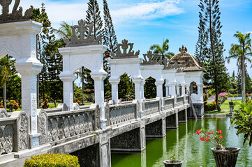 Bridge to a palace over an artificial lake, Bali, Indonesia