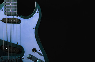 Colorful electric guitar on black background. Musical instrument