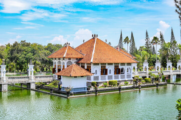 Palace in the middle of an artificial lake surrounded by gardens, Bali, Indonesia