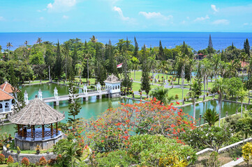 Palace in the middle of an artificial lake surrounded by gardens, Bali, Indonesia