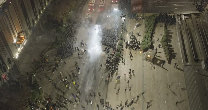 Thousands of protesters in the streets of Tbilisi to protest against the government's decision to suspend accession talks with the European Union. Protesters clash with Georgian police. Aerial protest
