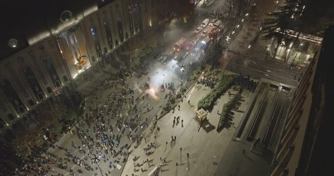 Thousands of protesters in the streets of Tbilisi to protest against the government's decision to suspend accession talks with the European Union. Protesters clash with Georgian police. Aerial protest