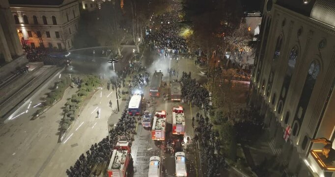 Thousands of protesters in the streets of Tbilisi to protest against the government's decision to suspend accession talks with the European Union. Protesters clash with Georgian police. Aerial protest
