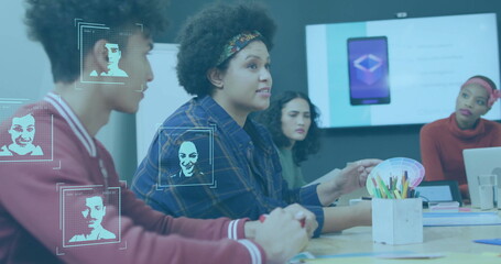 Facial recognition image over diverse business team discussing in meeting room