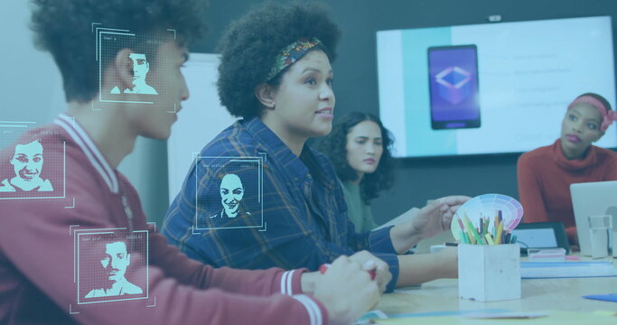 Facial recognition image over diverse business team discussing in meeting room - Powered by Adobe