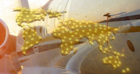 Image of media icons and world map over plane