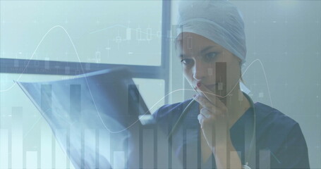 Image of financial data processing over caucasian female surgeon in hospital