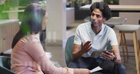 Image of financial data processing over diverse colleagues discussing work in office