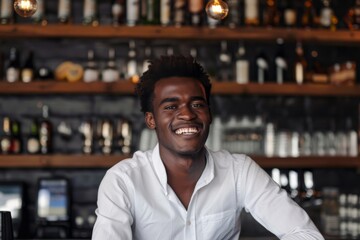 Fototapeta premium Smiling portrait of a young African American male bartender