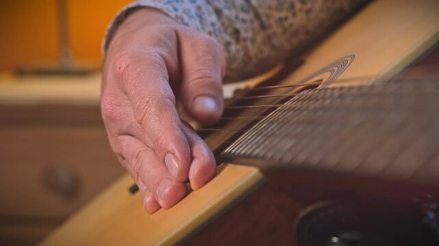 Strings of Soul
Close-up shot of a man skillfully playing the guitar. Enjoy the intricate fingerwork and beautiful melodies.
09.11.2024