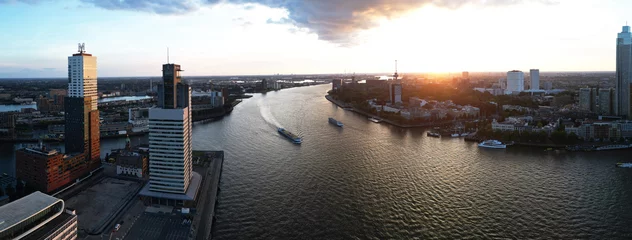 Fotobehang Erasmusbrug Luchtfoto Rotterdam bij gouden zonsondergang  © corlaffra