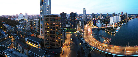 Aerial view of the city of Rotterdam and Erasmusbridge at sunset, The Netherlands