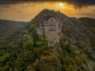Aerial view of Burg Katz (Cat castle) above the German town of Sankt Goarshausen in Rhineland-Palatinate.  Dramatic sunset background