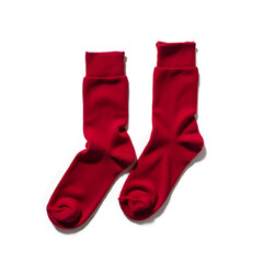 A pair of fuzzy Christmas-themed socks on a white background