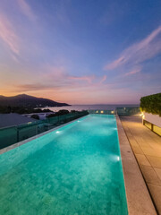 Fototapeta premium Evening tranquility by the infinity pool in Thailand