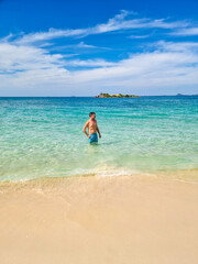 Enjoying a tranquil moment in the crystal-clear waters of Samae San Island Thailand