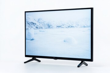 Fototapeta premium Modern flat-screen tv displaying snowy mountain landscape against white background