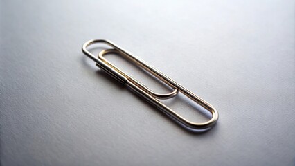 Paper clip isolated on background, office supplies, stationery, metal, silver, simple, utility, document, attachment, isolated
