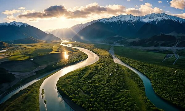 Aerial View of Winding River Near Mountains