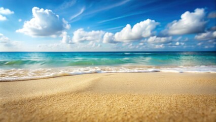 Fototapeta premium Sandy beach with blurred ocean in the background, summer, beach, ocean, sand, waves, vacation, relaxation, sunny, paradise