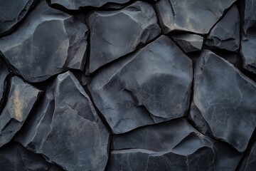 High-resolution photography of bold black rock textures with refined details.