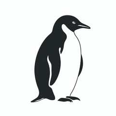 Obraz premium Penguin standing on ice in a cold environment showcasing its distinctive shape and features