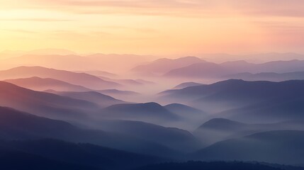 Obraz premium Idyllic sunrise over a misty valley with rolling hills and layers of light and shadow