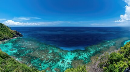 Fototapeta premium Breathtaking Coastal View of Turquoise Waters and Lush Greenery Under a Bright Blue Sky Perfect for Travel and Nature Enthusiasts