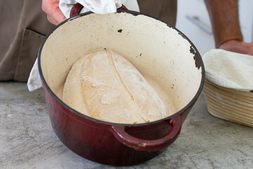 Sough-dough bread mixing and baking here baked in Dutch oven and ready for browning off.