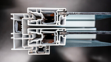 aluminum profile or aluminium section of sliding door or window frame with tempered glass and insect wire screen. Architectural element extrusion details and material design sample