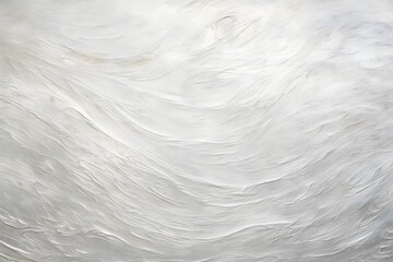 Obraz premium Abstract texture with soft, swirling white patterns resembling clouds or waves.